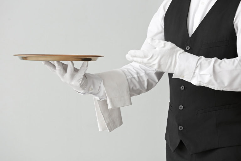 Minerva Private butler holding a tray